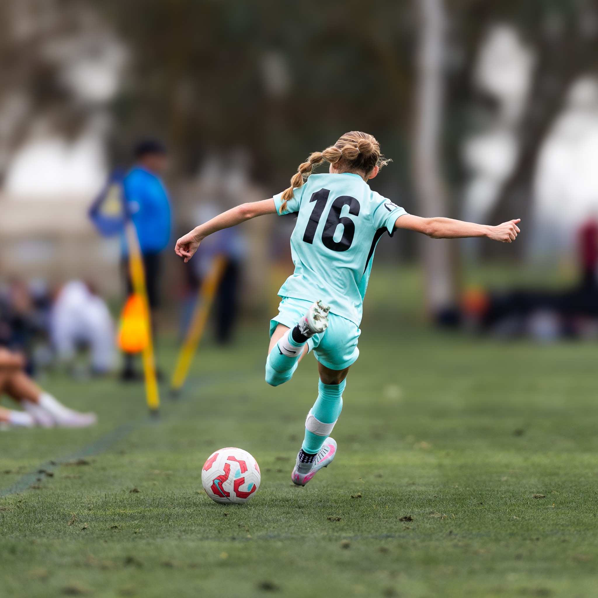 San Juan soccer player dribbling downfield
