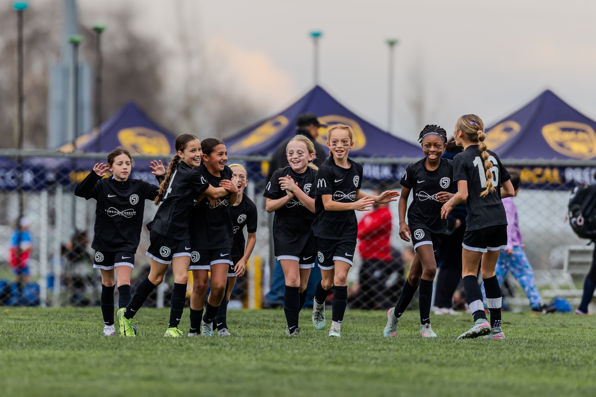 Youth soccer teammates celebrating together