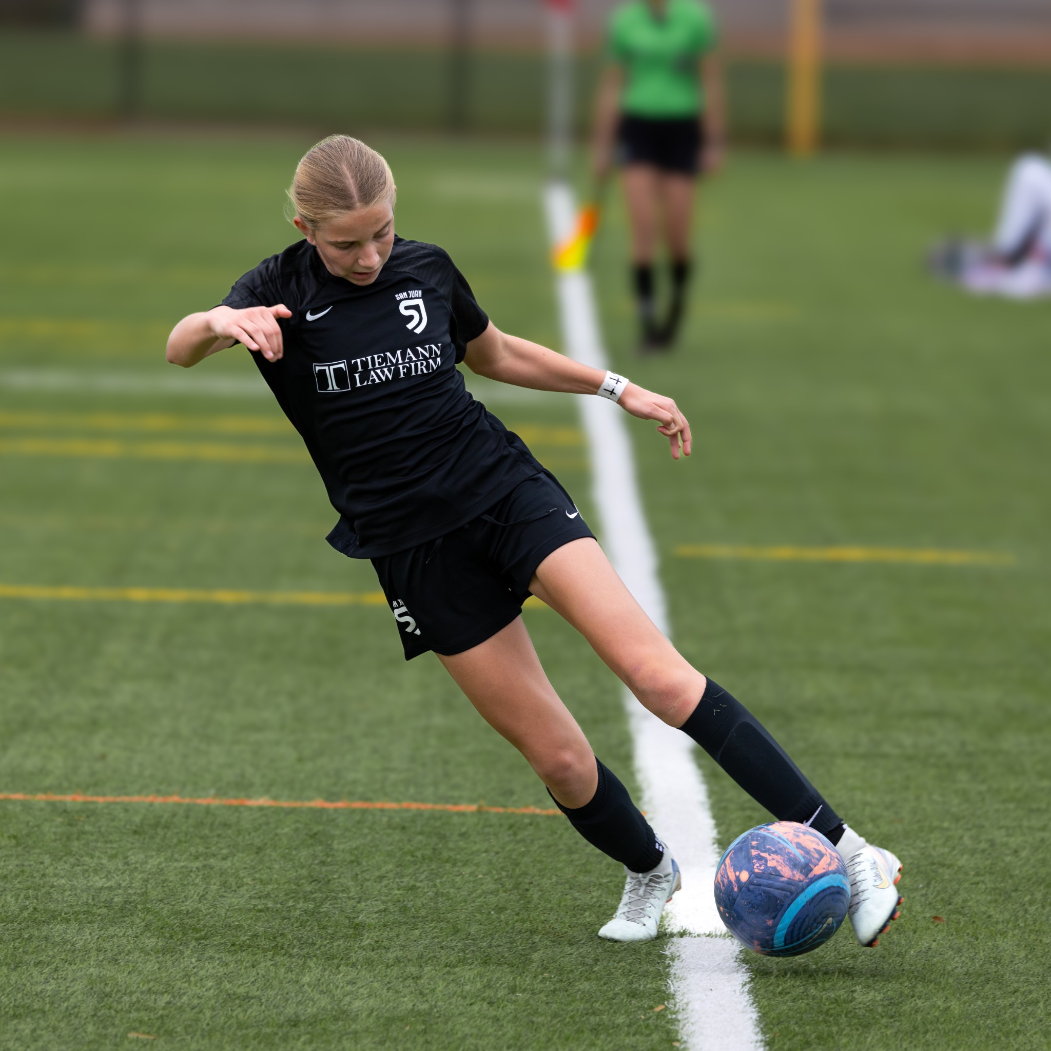 San Juan soccer player striking the ball
