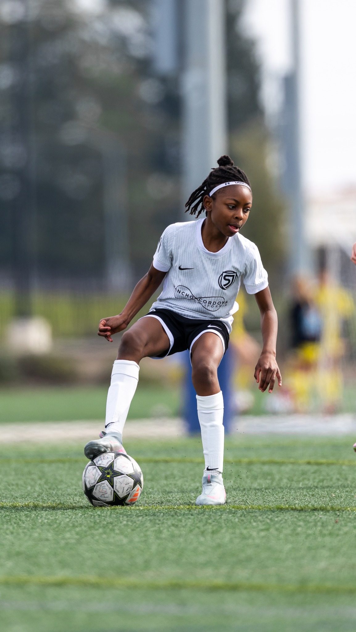 Youth soccer player controlling the ball